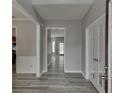 Inviting entryway featuring wood floors, neutral paint and an open view of the home's interior at 2341 Walnut Tree Ct, Buford, GA 30519