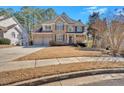 Beautiful two-story brick home with a well-maintained front yard, two-car garage, and inviting curb appeal at 79 Nimblewood Trl, Acworth, GA 30101