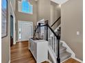 Bright foyer with hardwood floors, staircase, and a view of the front door at 79 Nimblewood Trl, Acworth, GA 30101