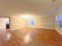 Bright and airy living room featuring hardwood floors and a stylish chandelier at 2098 Cutleaf Creek Rd, Grayson, GA 30017