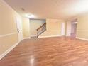 Spacious living room showcasing hardwood floors and neutral-colored walls at 2098 Cutleaf Creek Rd, Grayson, GA 30017