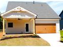 New home featuring a two-car garage and covered patio at 133 Old Alabama Se Rd, Emerson, GA 30137
