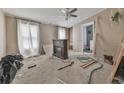 Bedroom with a ceiling fan, natural light, and potential for renovation and personalization at 1010 Martin Ln, Canton, GA 30114