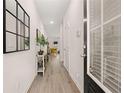 Bright hallway with light-wood floors and a view into the well-lit living area at 1342 Magnolia Way Bnd # 287, Jonesboro, GA 30238
