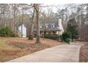 Residential home with a long driveway and view of neighborhood at 345 Wimberly Way, Powder Springs, GA 30127