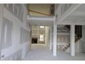 Open foyer with soaring ceilings and staircase to the upper level at 3686 Thornhill Ct, Douglasville, GA 30135