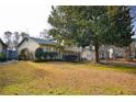 Charming home featuring well maintained lawn and landscaping, offering curb appeal and a welcoming ambiance at 6929 Hickory Log Rd, Austell, GA 30168