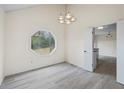 Cozy dining room with a unique octagonal window and modern gray flooring at 3032 Ross Rd, Snellville, GA 30039
