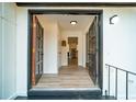 Inviting entryway featuring an open double door and modern lighting fixtures at 4324 Rue Saint Michel, Stone Mountain, GA 30083
