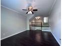 Open-concept living room with gleaming hardwood floors and neutral wall colors at 4244 River Green Nw Dr # 111, Atlanta, GA 30327