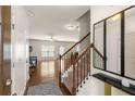 Welcoming foyer with hardwood floors and staircase at 1749 Charcoal Ives Rd, Lawrenceville, GA 30045