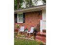 Inviting front porch features seating and decor with a welcoming sign at 2413 Hillside Ave, Decatur, GA 30032