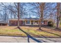 Traditional home with a brick facade and a tidy front yard situated among mature trees at 2826 Summit Ridge Dr, Marietta, GA 30066
