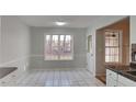 Bright dining area boasting ample natural light from a large window at 285 Belmont Trl, Covington, GA 30016