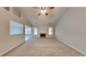 Spacious living room featuring a fireplace, neutral walls, and large windows at 285 Belmont Trl, Covington, GA 30016