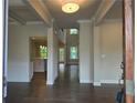 Open entryway featuring hardwood floors, white trim, and a view of the modern kitchen at 3687 Thornhill Ct, Douglasville, GA 30135