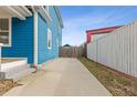 View of the concrete driveway along the side of the house leading to the backyard at 1598 Jonesboro Se Rd, Atlanta, GA 30315