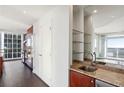 A cozy kitchenette adjacent to the living area, featuring granite countertops and convenient storage at 3325 Piedmont Ne Rd # 1502, Atlanta, GA 30326