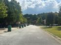 Tree lined street view within community at 5768 Windgate Ln, Lithonia, GA 30058