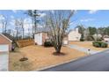 Spacious two-story home with brick accents, a well-kept lawn, and a newly constructed wooden fence at 2275 Perch Sw Way, Marietta, GA 30008