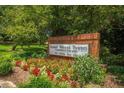 Mount Vernon Towers signage with a floral display and shrubbery at 300 Johnson Ferry Ne Rd # B401, Atlanta, GA 30328