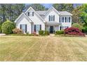 Inviting two-story home with a meticulously maintained lawn and colorful landscaping at 4265 Elmhurst Ln, Cumming, GA 30028