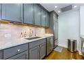 Charming kitchen displays gray cabinets, stainless steel appliances, and granite counters at 145 15Th Ne St # 1012, Atlanta, GA 30309