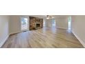 Spacious living room boasts a stone fireplace and modern flooring, perfect for gatherings and relaxation at 250 Southmoor Cir, Stockbridge, GA 30281