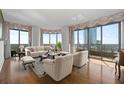 Bright living room featuring hardwood floors and expansive windows at 750 Park Ne Ave # 21E, Atlanta, GA 30326