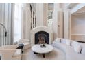 Elegant lobby with stylish fireplace, seating, and mirrored columns at 750 Park Ne Ave # 21E, Atlanta, GA 30326