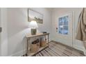 Stylish entryway featuring a console table with decor and a view of the front door at 259 Vista Ln, Woodstock, GA 30189