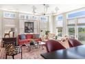 Sun-filled living room with neutral colors, a comfortable seating arrangement and outdoor views at 2500 Peachtree Nw Rd # 606N, Atlanta, GA 30305