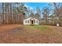 Lovely one-story home surrounded by trees and a spacious yard, offering privacy and outdoor space at 80 Holder St, Temple, GA 30179