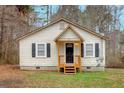 Inviting one-story home with a quaint front porch, black shutters, and a well-maintained lawn at 80 Holder St, Temple, GA 30179