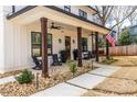 Inviting front porch with rocking chairs, swing, and stylish decor creates a welcoming outdoor space at 1751 Stanwood Se Ave, Atlanta, GA 30317