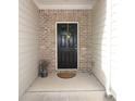 Inviting front entrance with a black door, brick surround, and decorative accents at 5433 Cascade Sw Rdg, Atlanta, GA 30336