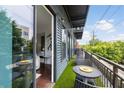 Private balcony features seating and green space with views of the surrounding neighborhood at 200 N Highland Ne Ave # 207, Atlanta, GA 30307