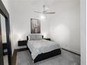 Cozy bedroom with a ceiling fan, decorative artwork, and minimalist floating nightstands at 200 N Highland Ne Ave # 207, Atlanta, GA 30307