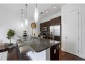 Modern kitchen featuring granite countertops, stainless steel appliances, and bar seating at 200 N Highland Ne Ave # 207, Atlanta, GA 30307