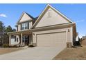 Charming two-story home featuring a two-car garage and covered front porch at 250 Riverclub Rd, Acworth, GA 30101