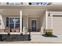 Inviting front porch with decorative lions, seating, and a stained glass front door at 250 Riverclub Rd, Acworth, GA 30101