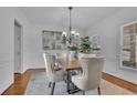 Formal dining room with modern chandelier and stylish decor at 4050 Preserve Crossing Ln, Cumming, GA 30040