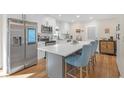 Modern kitchen featuring stainless steel appliances, a spacious island with seating at 470 Oriole Dr, Marietta, GA 30067