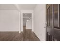 Open entryway showcasing hardwood floors and neutral walls leading to the main living areas at 290 Halibut Cir, Covington, GA 30016