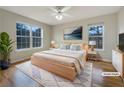 Cozy bedroom with a large window, wood floors and comfortable decor at 17 Cedars Glen Pl, Villa Rica, GA 30180