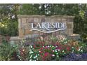 Stone sign welcomes you to the Lakeside community with colorful flowers at 1279 Lakeside Overlook, Canton, GA 30114