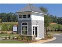 Close up of the Community guardhouse with windows and gray wood shakes at 1279 Lakeside Overlook, Canton, GA 30114