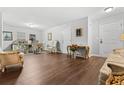 Spacious living room featuring hardwood floors, elegant decor, and ample natural light at 236 Rankin Cir, Mcdonough, GA 30253