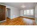 Bright living room with hardwood floors, large windows, and neutral paint, creating a warm and inviting space at 2895 Akron St, Atlanta, GA 30344