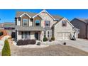 Charming two-story home with brick and siding exterior, featuring a two-car garage at 3488 In Bloom Way, Auburn, GA 30011